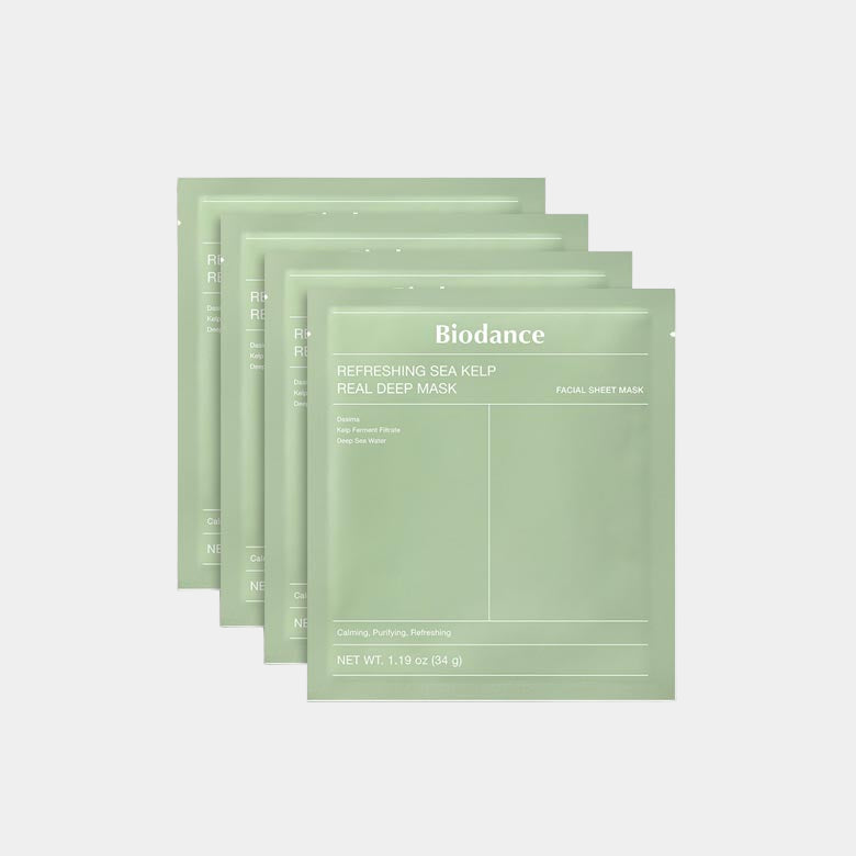 4 green Biodance facial sheet masks on a white background