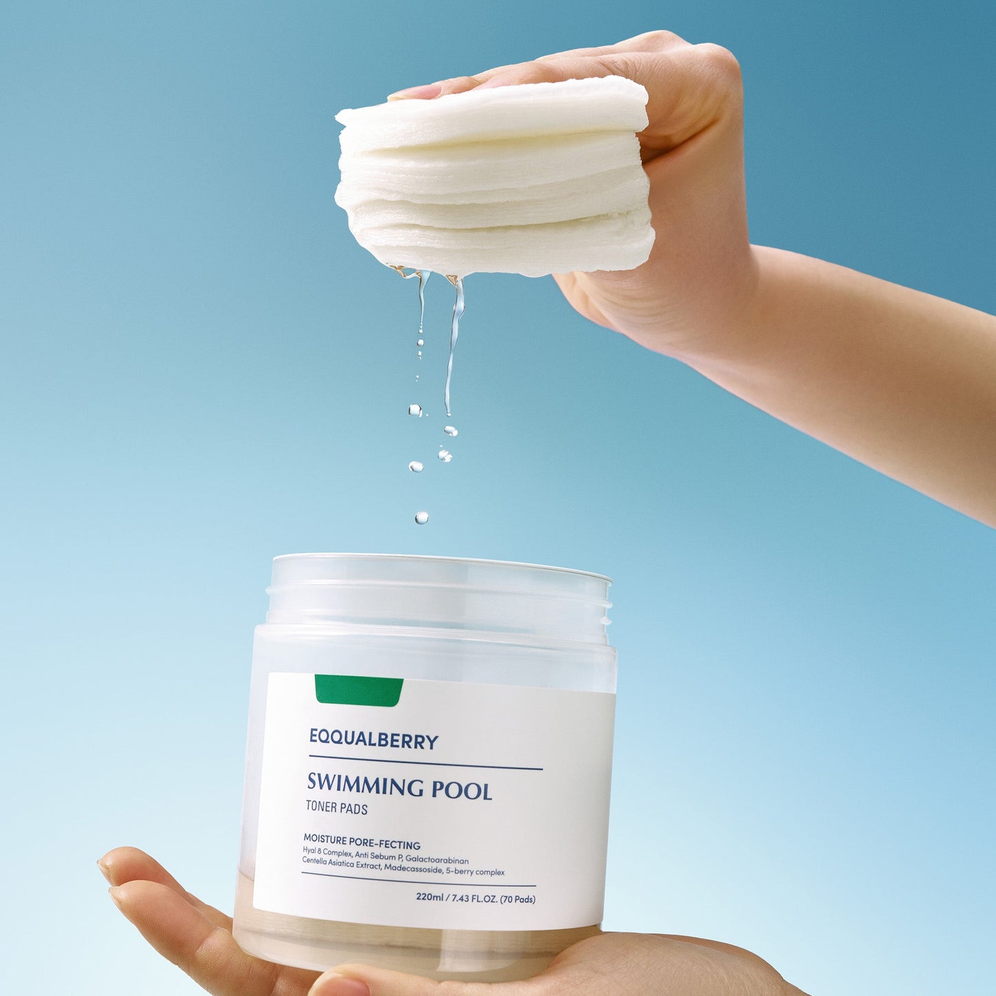 Hand holding a stack of white pads above a container labeled 'EQUALBERRY Swimming Pool' against a blue background.